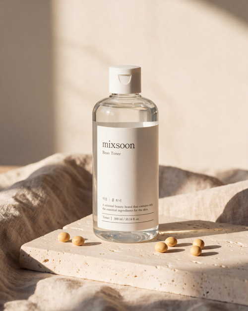 Mixsoon Bean Toner on a stone block with linen and a few soybeans